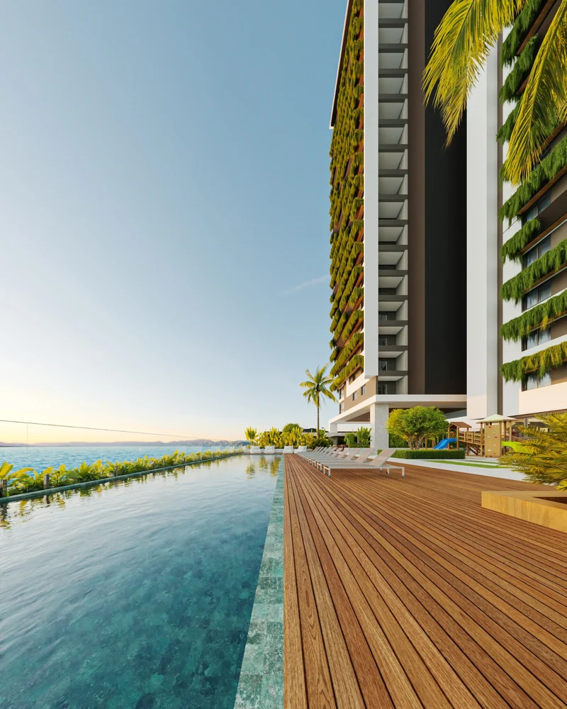Piscina junto às torres residenciais com deck de madeira